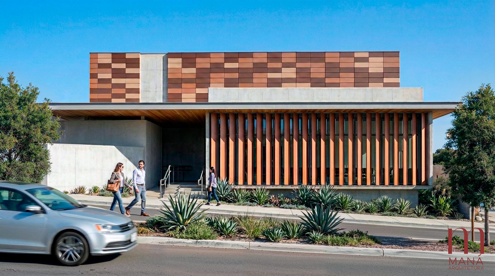 Fachada do Hospital e Maternidade Alto Taquari, projetado pela Maná Arquitetura, com pessoas caminhando na entrada